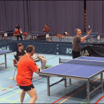 Two guys playing extreme ping pong.